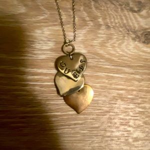 Guess brand silver and gold 3 stacked hearts necklace